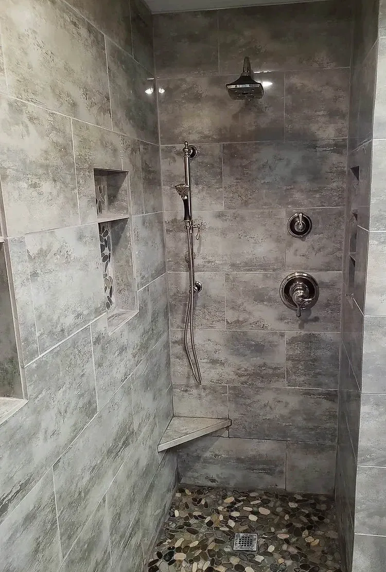 Granite Vanity & Walk-In Shower walk-in shower with custom foot prop and niches