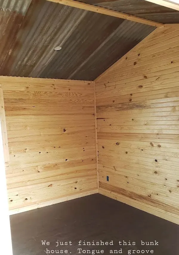 Finished exposed box beams in vaulted living room ceiling